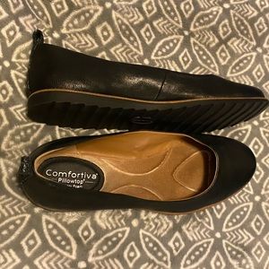Black leather flats by Comfortiva